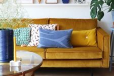 02 a bright living room done in mustard and shades of blue and navy is a gorgeously bold idea