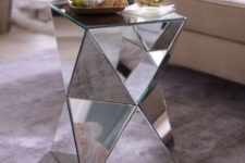 a mirrored coffee table is a clever idea to add mirrors to your space