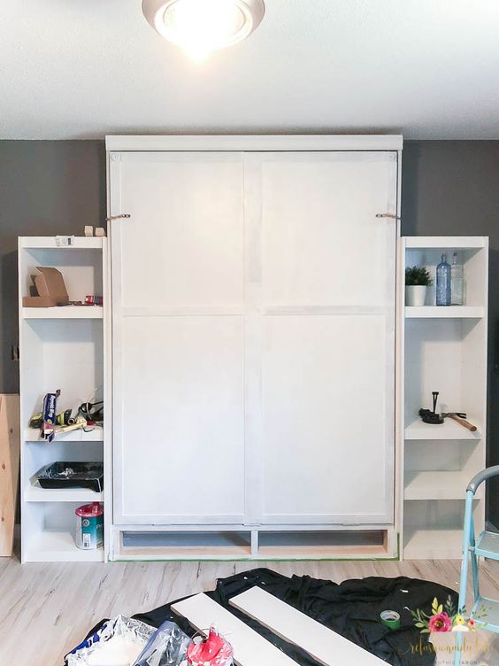 here's how a Murphy bed looks when not in use, just add shelves on each side to make the piece more functional