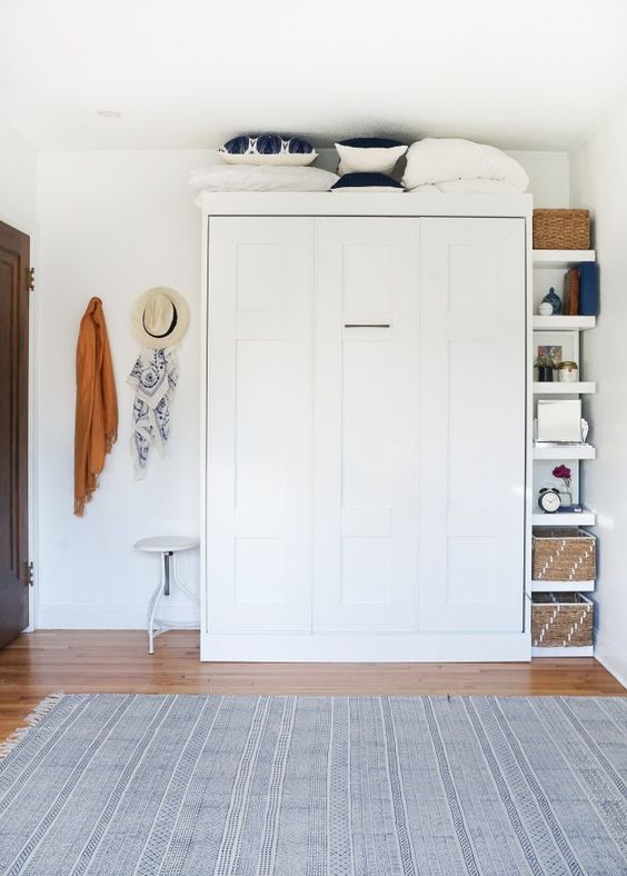 a hidden Murphy bed looks sleek, doesn't clutter the space and you can have a whole room for yourself