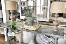 03 a summer shabby chic meets farmhouse entryway with potted greenery, baskets and wooden lamps with burlap lampshades