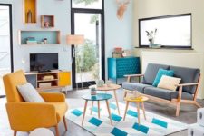 04 a bright retro living room in bold blue and yellow with a touch of geometric pattern