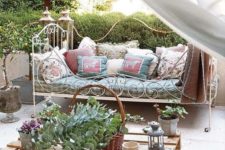 04 a super elegant and French chic forged daybed with lots of pillows on casters is a great piece for a romantic area