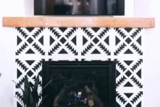 06 super bright black and white geometric tiles and a light-stained wood mantel for a boho chic living room
