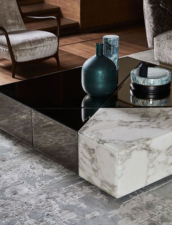 a gorgeous coffee table in black and white marble can be disassembled into several different pieces with geometric shapes