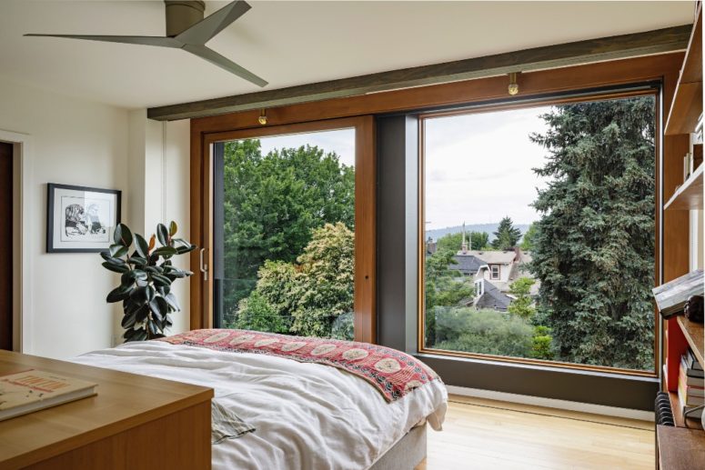 The bedroom is also done with such a window to enjoy the views and there are shades for privacy