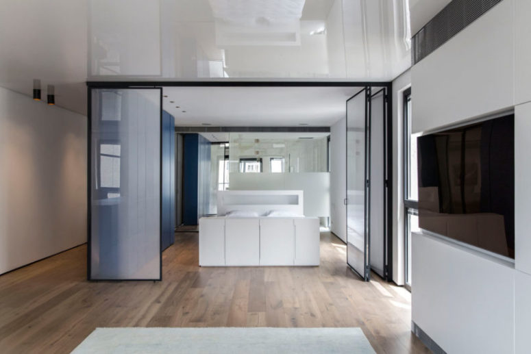 There's also a bathroom integrated into the bedroom and a large sleek blue unit for storage