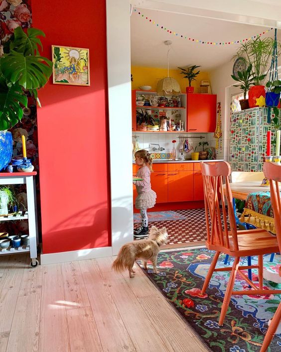 a colorful retro space in bright red, blue and yellow plus lots of bright patterns