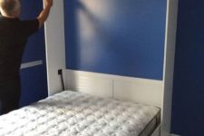 08 a vertical Murphy bed with a mattress attached with Velcros – you won’t have to move it every time