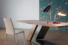 09 a large sculptural desk in rich stain and dark metal features a large comfortable base that makes a statement