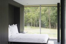 10 a laconic guest bedroom with a view and a Murphy bed can be transformed into any other space when the bed is not in use