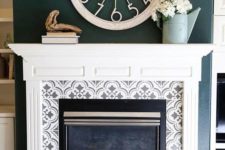 10 grey and white pattern mosaic tiles around the fireplace and on the floor plus a vintage white mantel create a chic and refined look