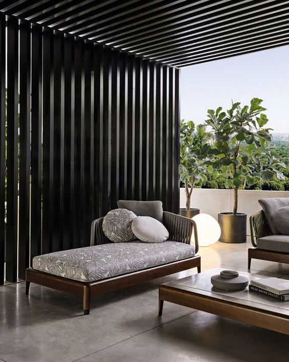 a modern dark stained outdoor daybed looks elegant and simple and will work for many outdoor spaces