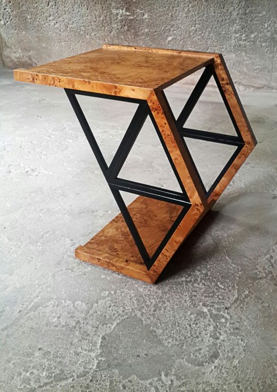 this geometric coffee table built of plywood and metal can be used as a stool, too, which is cool