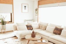 13 a large creamy sectional sofa in front of the window is a strategical idea that allows much light into the room