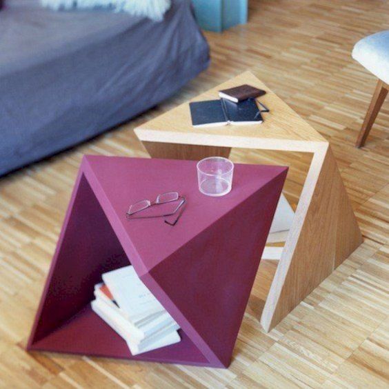 catchy geometric coffee table duo in pink and light stain is a creative idea, bold design and you can stack them to store