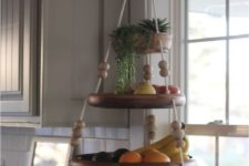 14 a fun hanging shelf for fruit with beads and ropes and some succulents on top is a cute and easy idea