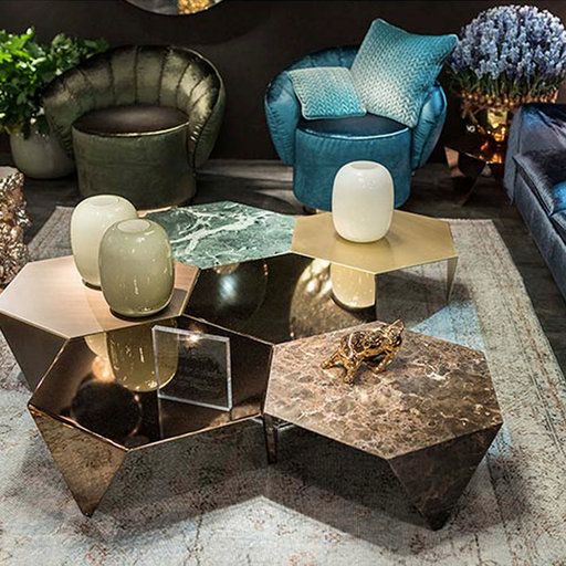 an arrangement of hexagon coffee tables done with various finishes and in various colors can be used together or separately
