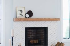 17 marble chevron clad tiles and a wooden mantel create a chic and stylish look and make the fireplace more elegant