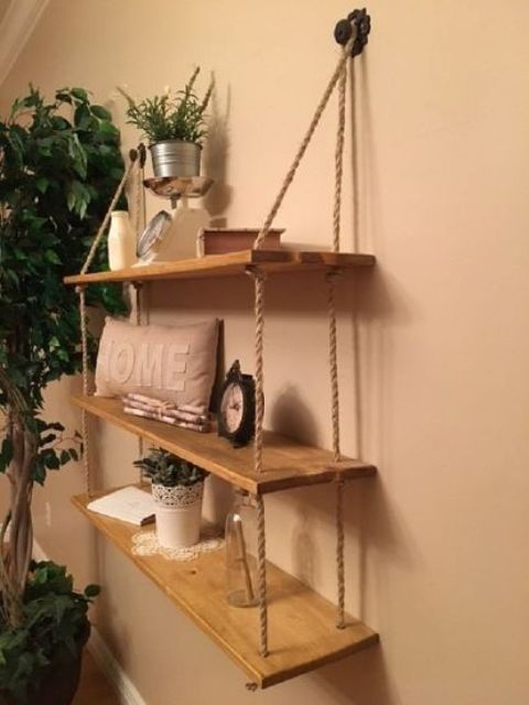 a rustic hanging shelf with ropes and simple wooden shelves can be DIYed for any space of your home