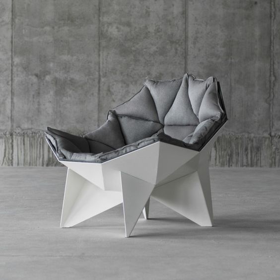 a geometric chair with a geometric upholstered cover is a chic statement for a contemporary or minimalist space