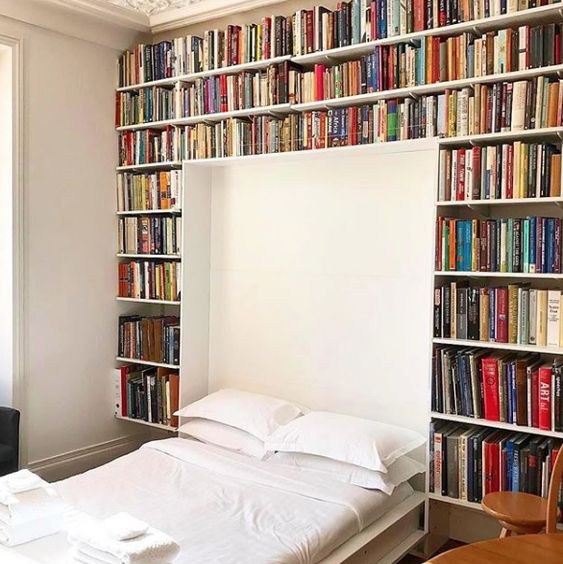 A library with a built in Murphy bed   make your space more functional and squeeze maximum of it