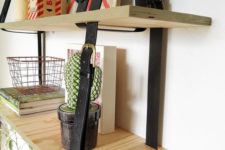 21 a two-layered hanging shelving unit done with plywood and leather belts is a cool modern idea