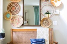 23 give your entryway a bold summer feel with a wall of decorative baskets – painted and printed ones and a striped pillow