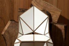 24 a white geometric and sculptural chair with gold touches looks very futuristic and super bold