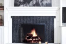 24 if you have a monochromatic space, clad your fireplace with black tiles in a herringbone pattern and add stone for a chic look