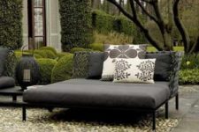 25 a contemporary dark daybed with printed pillows will accommodate more than one person and will add a modern feel to the space