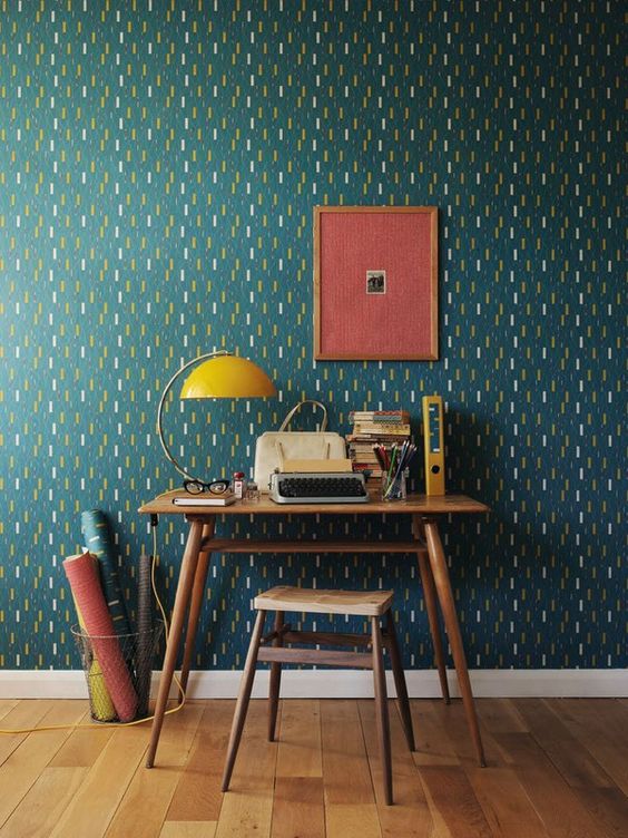Teal wallpaper with a unique abstract pattern will easily make the space retro and mid century chic