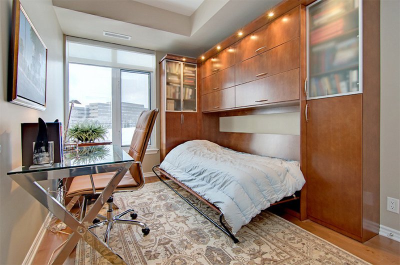 An elegant home office with a built in Murphy bed for guests or just to nap