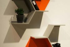 26 part hexagon shelves in grey and bold orange are a nice idea for storage and make a statement with the shape and color