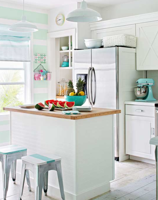 X detailed cabinets are paired with industrial stools, vintage fittings and touches of turquoise