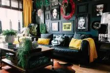 a stylish living room with a bold black gallery wall