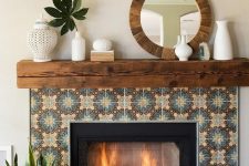 a built-in fireplace clad with colored patterned tiles around, with a rich stained wooden slab mantel
