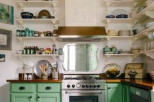 a colorful vintage meets rustic kitchen with a tiled hood, a rust stripe, green cabinets and white shelves