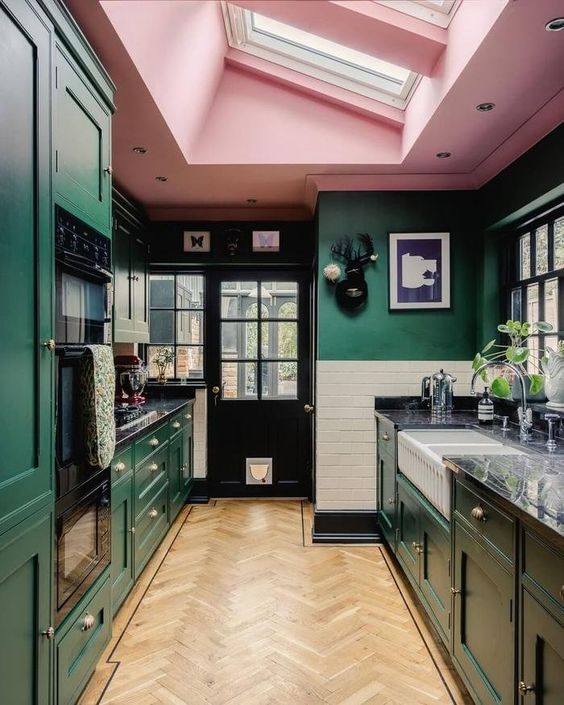 a bold kitchen design with green walls