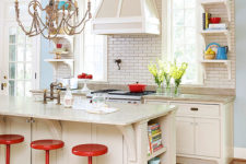 a fancy eclectic kitchen presents refined details and relaxed furniture plus a playful chandelier