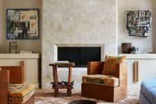 a fireplace clad with white Zellige tiles is a very cohesive and chic element of the living room, it brings a bit of texture
