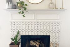 a fireplace clad with white hexagon tiles is a stylish and elegant solution for a mid-century modern living room