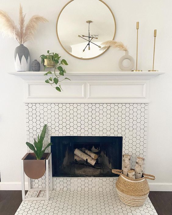A fireplace clad with white hexagon tiles is a stylish and elegant solution for a mid century modern living room