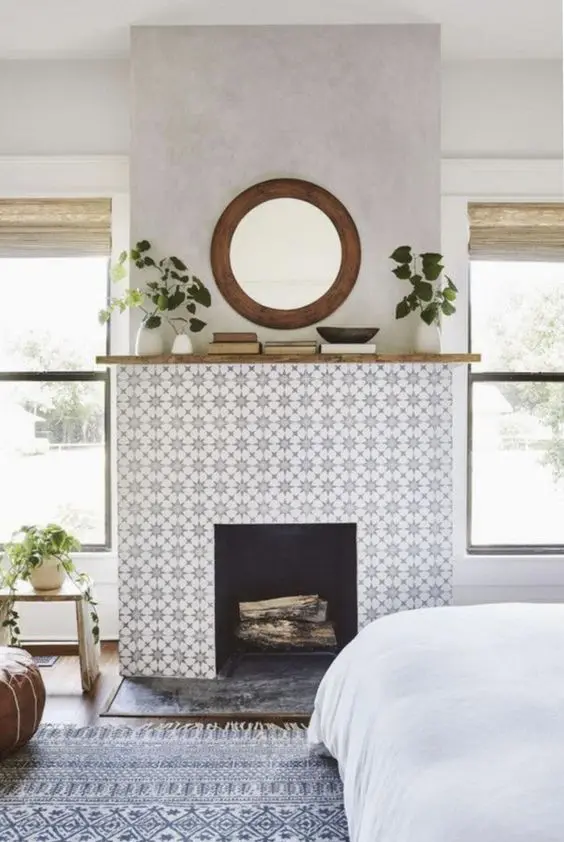 A fireplace with a pretty patterned brick surround is a lovely idea for a boho space, it looks eye catching yet neutral