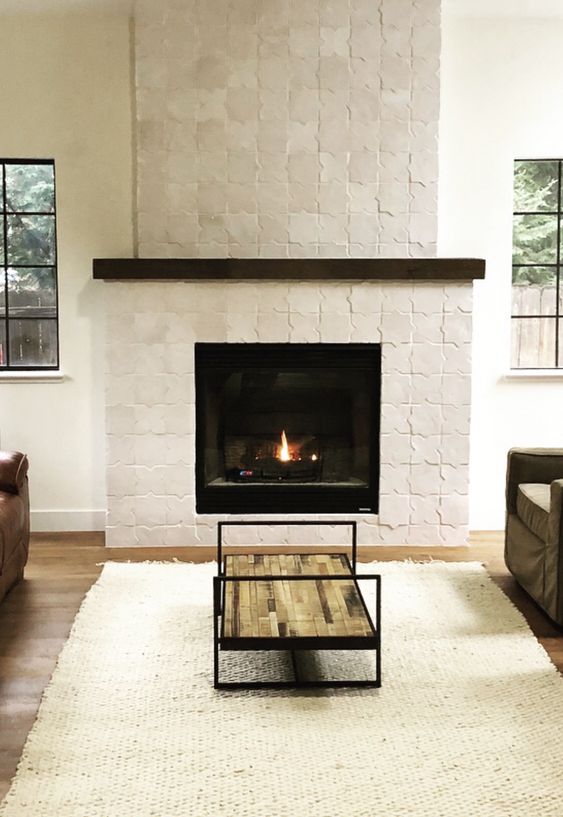 A fireplace with a white star shaped Zellige tile surround is a beautiful and eye catching feature for styling a space