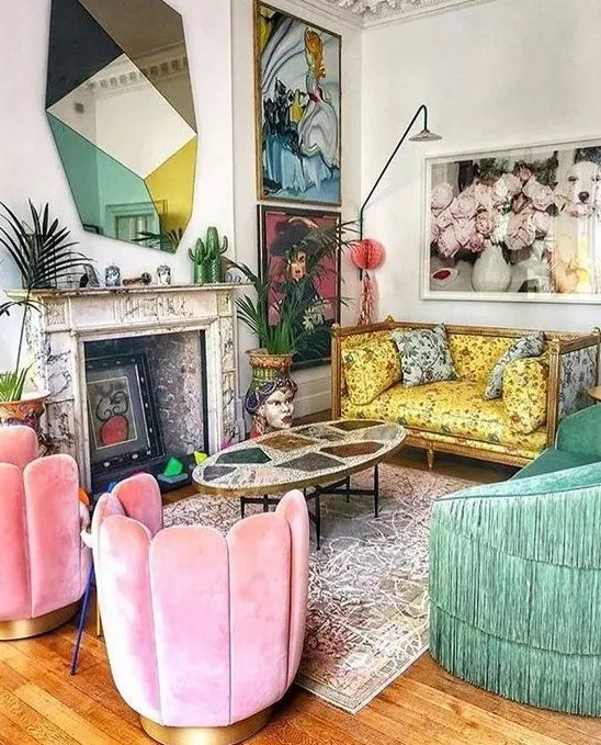 A maximalist living room with a yellow printed sofa, pink chairs and a green fringe sofa, bold artworks and a catchy mirror.