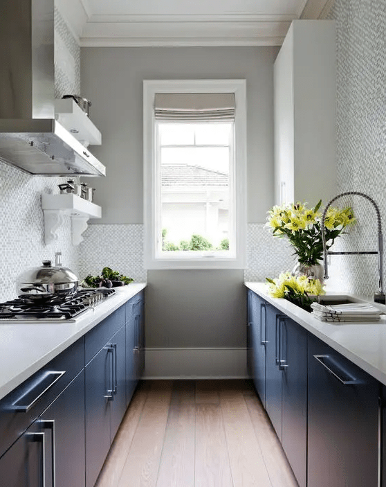 a stylish kitchen with navy cabinets, white stone countertops, a neutral tile backsplash is a cool idea if you don’t have much space