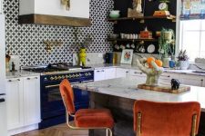 a stylish maximalist kitchen with black walls and an accent tile one, white cabinetry and a navy cooker, rust chairs and a marble countertop