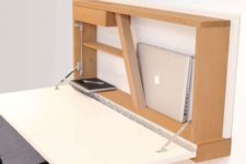 a stylish modern Murphy desk with a white desktop and a plywood base on the wall features soem storage space for holding your laptop
