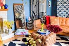a super colorful eclectic living room with jewel tones, several prints, catchy gold touches and a sleek TV unit